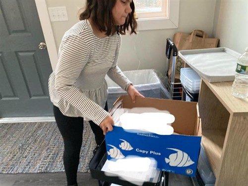 Gallery Image Chloe_refilling_paper_tray.jpeg