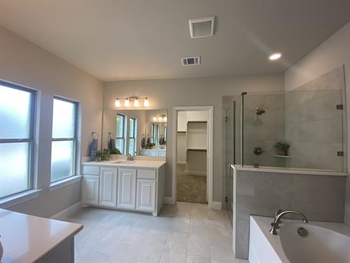 Spa like master bathroom with frameless shower & quartz counters included