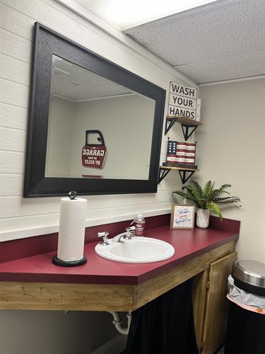 Restroom with changing table.