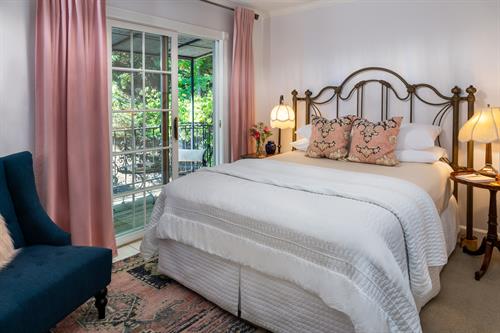 Chantilly Rose room with a balcony that overlooks the back garden.