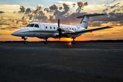 Airplane on the Runway at Sunset