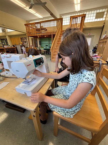 Practical life skills like sewing develop patience, coordination, and independence.