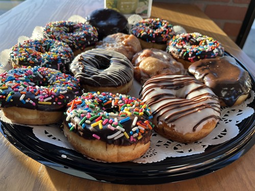 House bakery selection at The Screaming Bean café, showcasing muffins, beignets, and sweet treats.