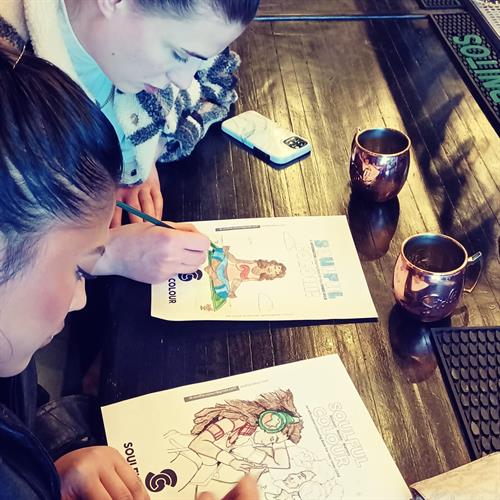 Enjoying the calm of colouring at a bar in Port Credit Mississauga