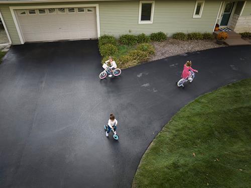 Family fun on a smoothly paved driveway