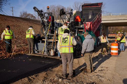 Installing asphalt on a chilly November morning 