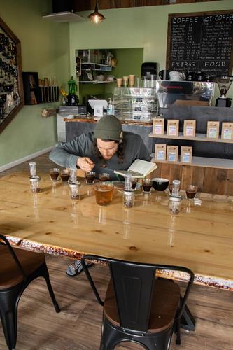 Owner evaluating new coffees for the cafe