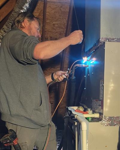 One of our techs installing a new furnace