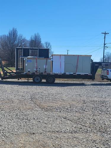 Transporting new HVAC equipment for an installation job