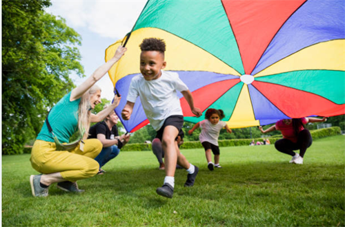 Gallery Image teacher_and_children_playing.png
