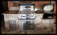 Example of an outdoor kitchen setup, complete with Primo and FireMagic grills