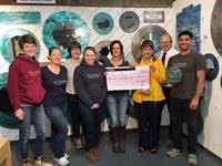 Jo Downs and her team Cheque presentation from Padstow to Rock Swim 2017 sponsorship and Jo's London Marathon Challenge