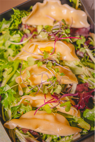 Dumplings on a bed of greens.