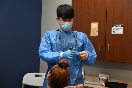 Secure Dental Danveports' Dr. Daniel Kang with dental patient.