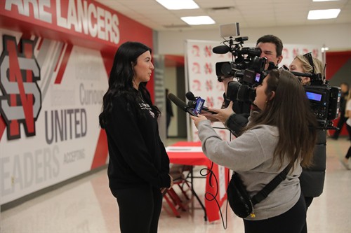 North Scott Graduate Mackenzie Moeller speaks to the press about her college plans in Spring of 