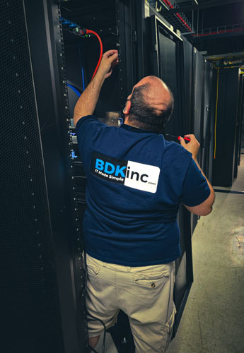 A BDK technician working on a rack in one of our data centers. A BDK technician working on a rack in one of our data centers.