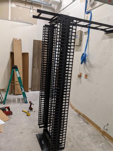 Two post data rack install, bolted to the ground and wall