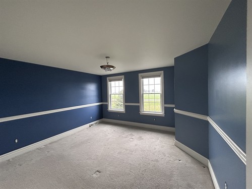 Gallery Image freshly-painted-blue-bedroom-with-dark-blue-accent-wall-4.jpg