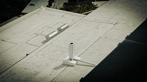 EPS Rooftop Housings. Dual Nozzle Sprinkler Heads Pop Out Of The Top Spraying In 360 Degrees, About 50 Feet