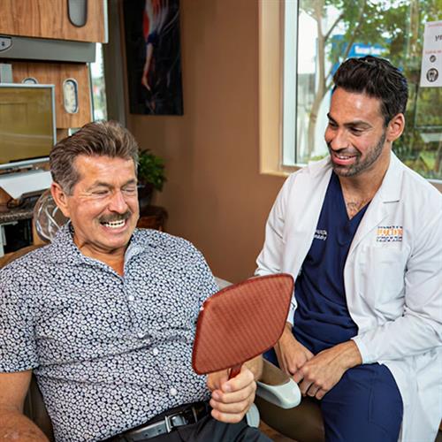 Dr. Ronald Ayzin with Patient