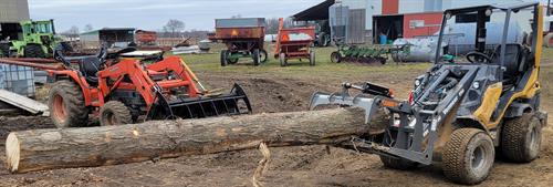 Compact Loader with Long Log