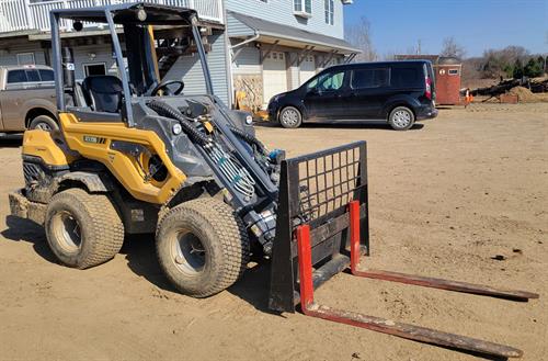 Compact Loader with Forks