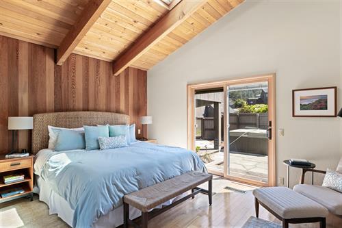 Principal bedroom with walkout to private courtyard and hot tub