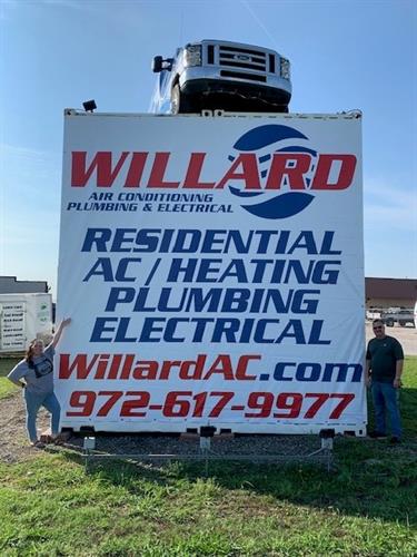 Office Manager, Emily, and our HVAC/AC Manager, Cort, proudly showing off the updated Willard logo!
