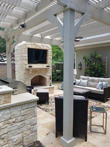Pergola with outdoor kitchen and fireplace