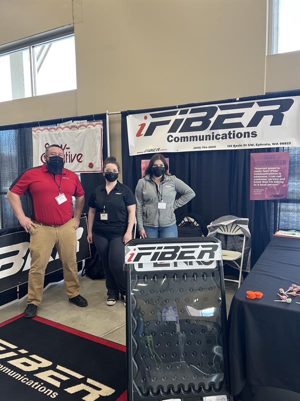 iFIBER employees with their booth at the Home Show at the Town Toyota Center