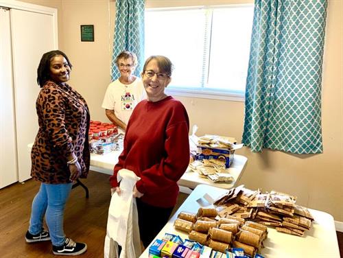n October 20th. Altrusans Brittany Sanders, Linda Bode, Debbie Lacuna and BJ Taylor (not pictured) filled 25 bags. Our club is proud to return to collaborating with GUMC in providing this worthy service.