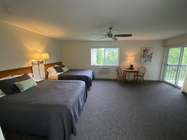 A2 - Option as an adjoining room. Spacious, with 2 queen beds, walks out to a shared patio overlooking the river