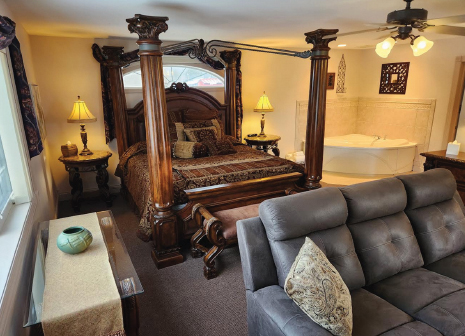 Our royal suite offers a California king 4-post bed with fireplace, lounge, jacuzzi and spacious bath. It is also ADA compliant and fully accessible