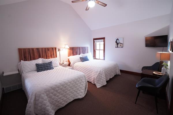 Bright fresh rooms with a queen and a full, both with sitting areas. Right off the boardwalk with outdoor seating.