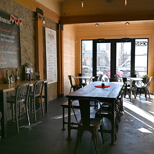 Your table is ready in our Tasting Room formerly the driveway of a circa 1920's Ford dealership. 