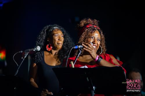 Background vocalists, Sheree Smith and Ange Kogutz perform at "Jazz at Pride - ATX". [Skybox on 6th, 2022]