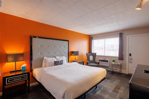 Premium King: Offers a mid-century charm and modern amenities. All decorated in a modern style, these rooms offer a King size bed, bathroom with tub/shower, mini fridge, microwave, 42" Tv and Apple Tv.