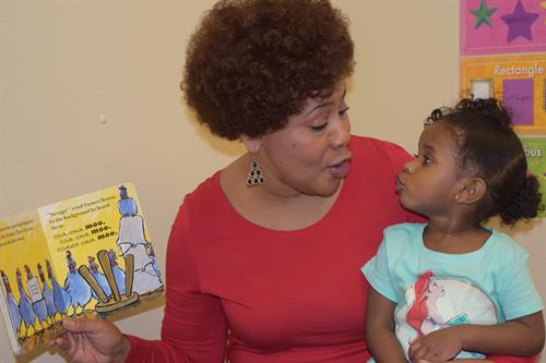Toddler teacher, Ms. Jackie, reading a story.