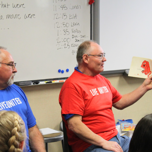 A business reading to a classroom of students celebrating Read Across America