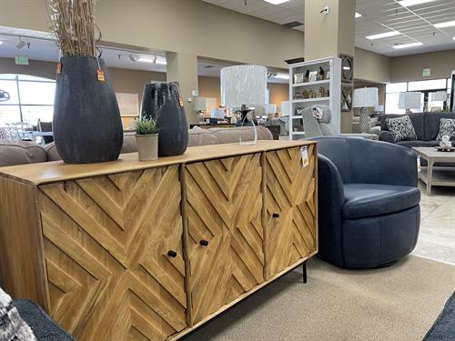 TV storage console with leather barrel chair