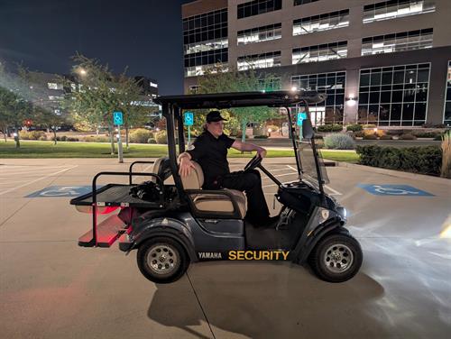 Security Officer patrolling on golf cart