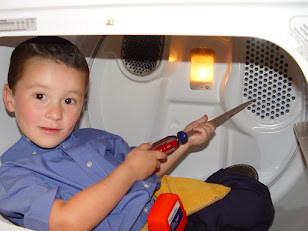 Chris started his appliance repair training when he was really young!  This is inside a dryer.