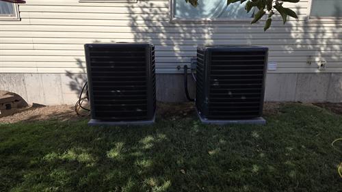 Two new high efficiency Goodman A.C.s moved from their previous location 10 feet down the house to provide room for an addition the customer had in mind