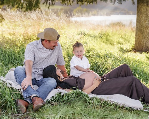 Maternity session family by lake.