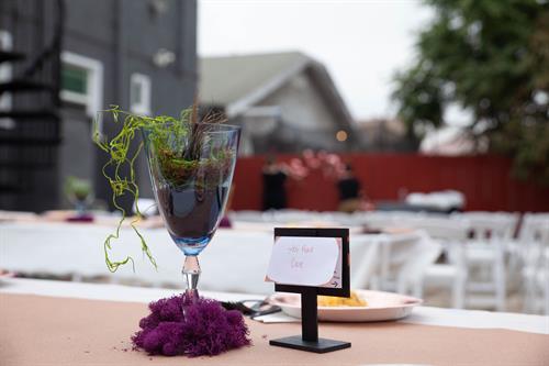 Milestone Birthday: Centerpiece close-up with event space in the background
