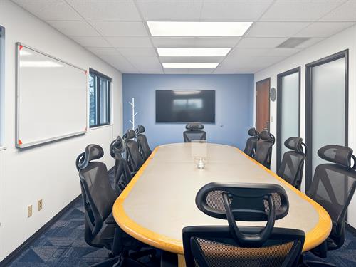 Meeting Room - Our 8-10 Person Meeting room here featured with 2 TV monitors as well as a whiteboard. 