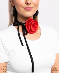 red rose on black silky ribbon