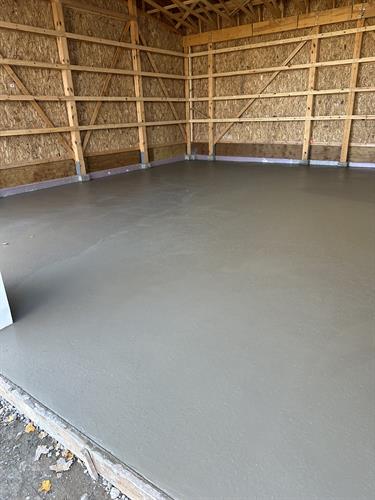 Concrete floor poured, and finished for this pole barn