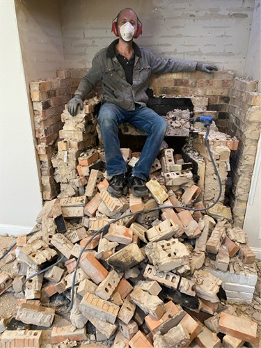 Demoing brick in prep of installation