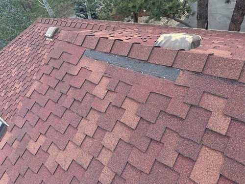 Gallery Image 2029_Werner_Lane_--_Missing_and_Creased_Shingles_area_one.jpeg